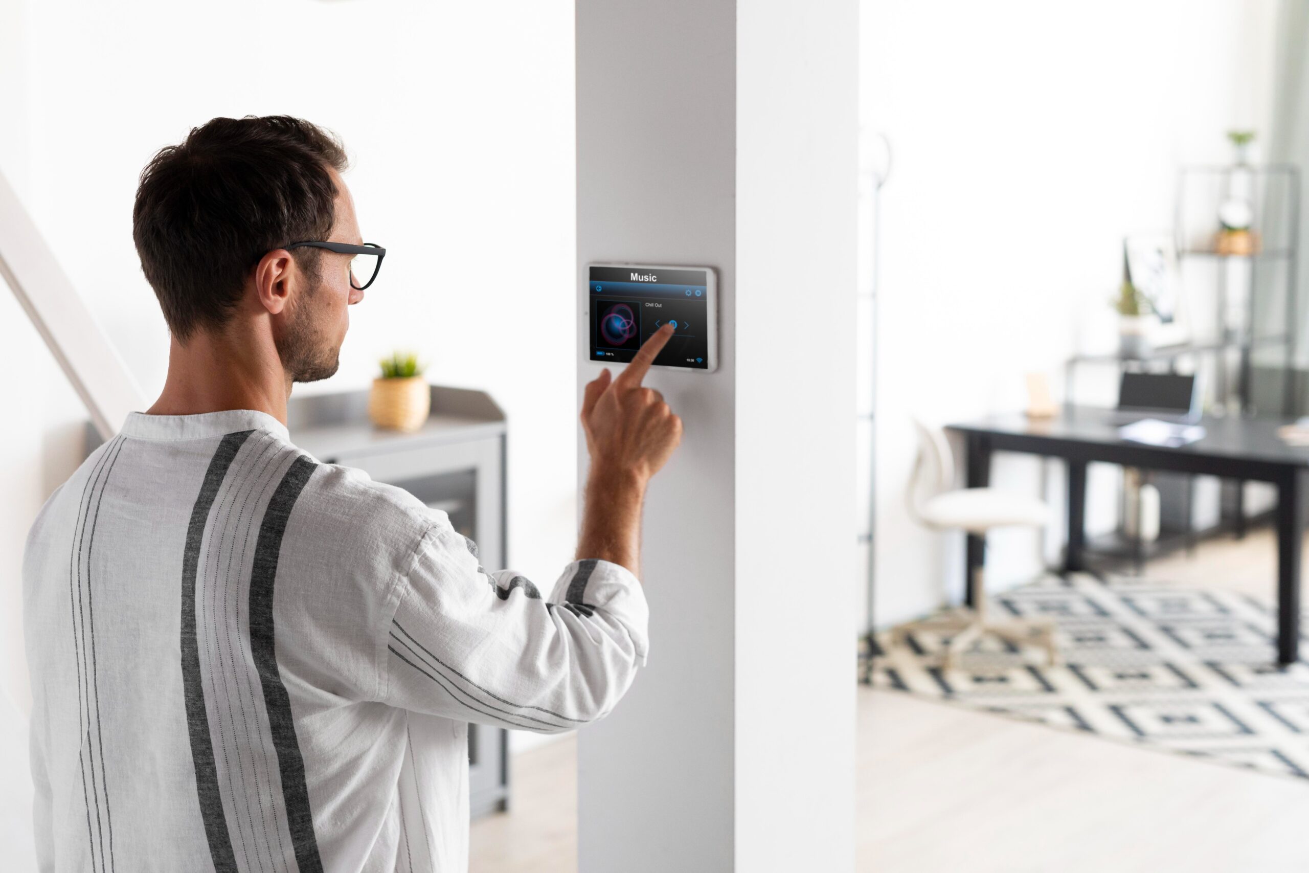 man-using-tablet-his-smart-home (1)