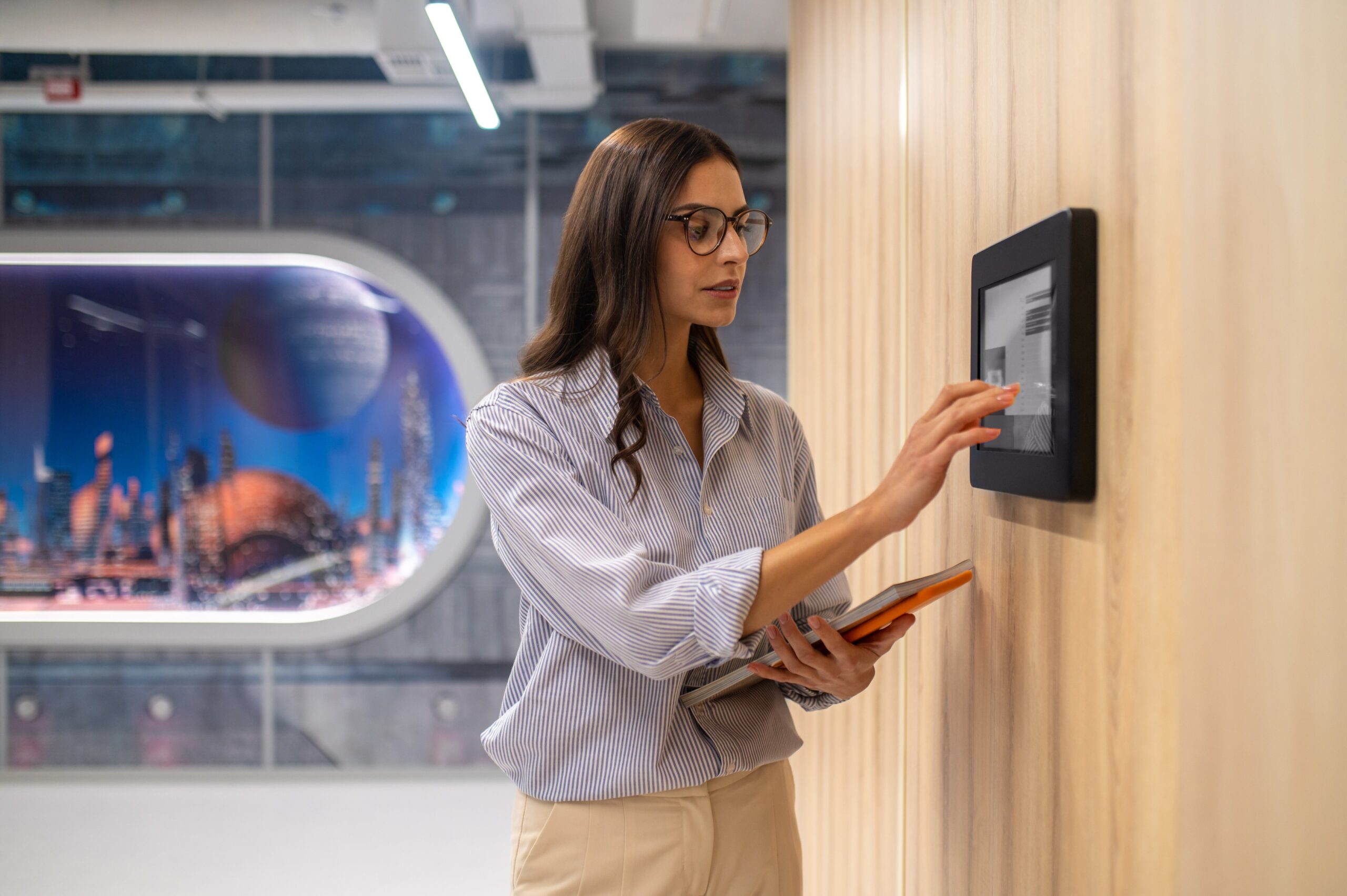 woman-touching-control-panel-wall-corridor (1)